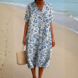 Laura — Ivory Dress Adorned with Porcelain Blue Floral Accents