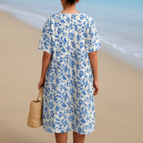 Laura — Ivory Dress Adorned with Porcelain Blue Floral Accents