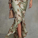 Aoife — Asymmetrical long dress in green satin with V-neck, flared puff sleeves, and floral pattern