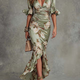 Aoife — Asymmetrical long dress in green satin with V-neck, flared puff sleeves, and floral pattern