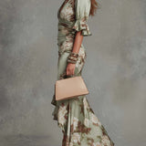 Aoife — Asymmetrical long dress in green satin with V-neck, flared puff sleeves, and floral pattern